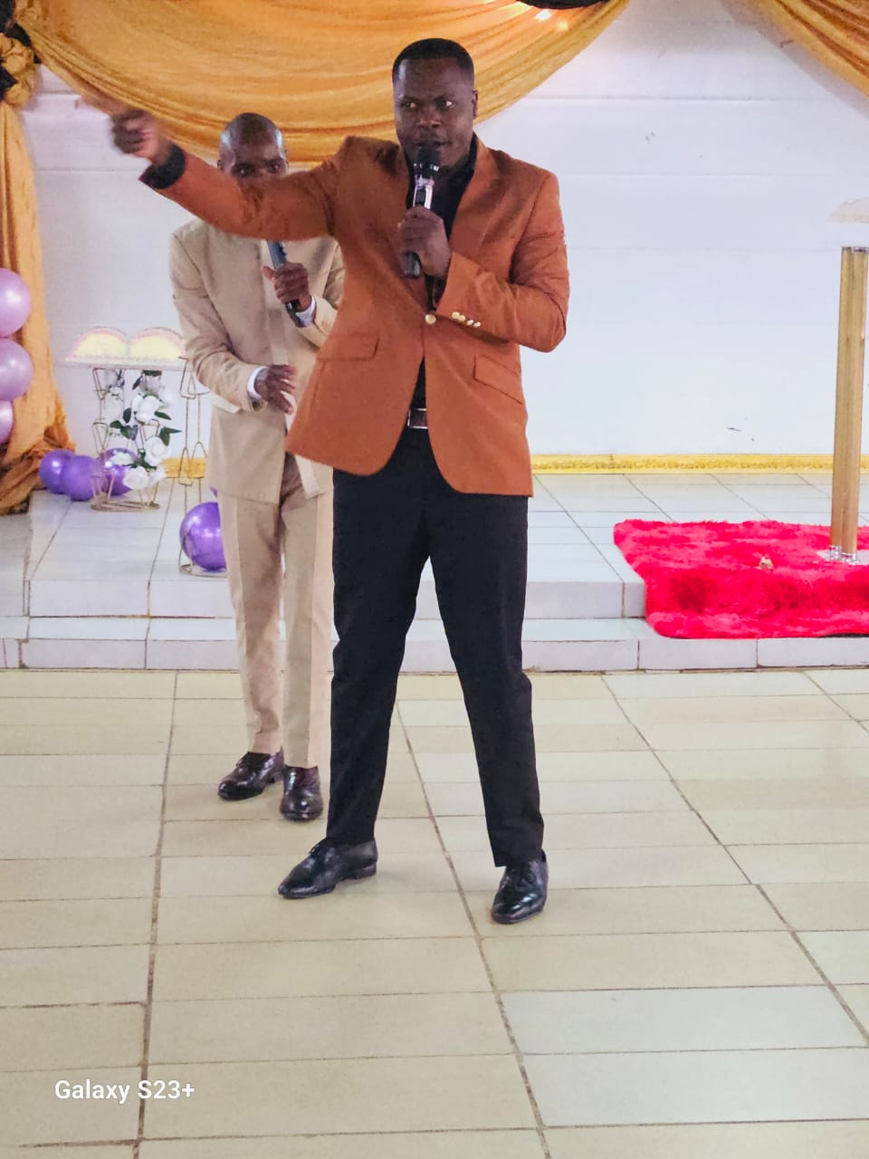 Prophet Bongani preaching with raised hand